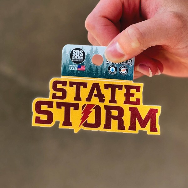 State Storm Gold & Cardinal Rugged Sticker (1.5"x3.5")